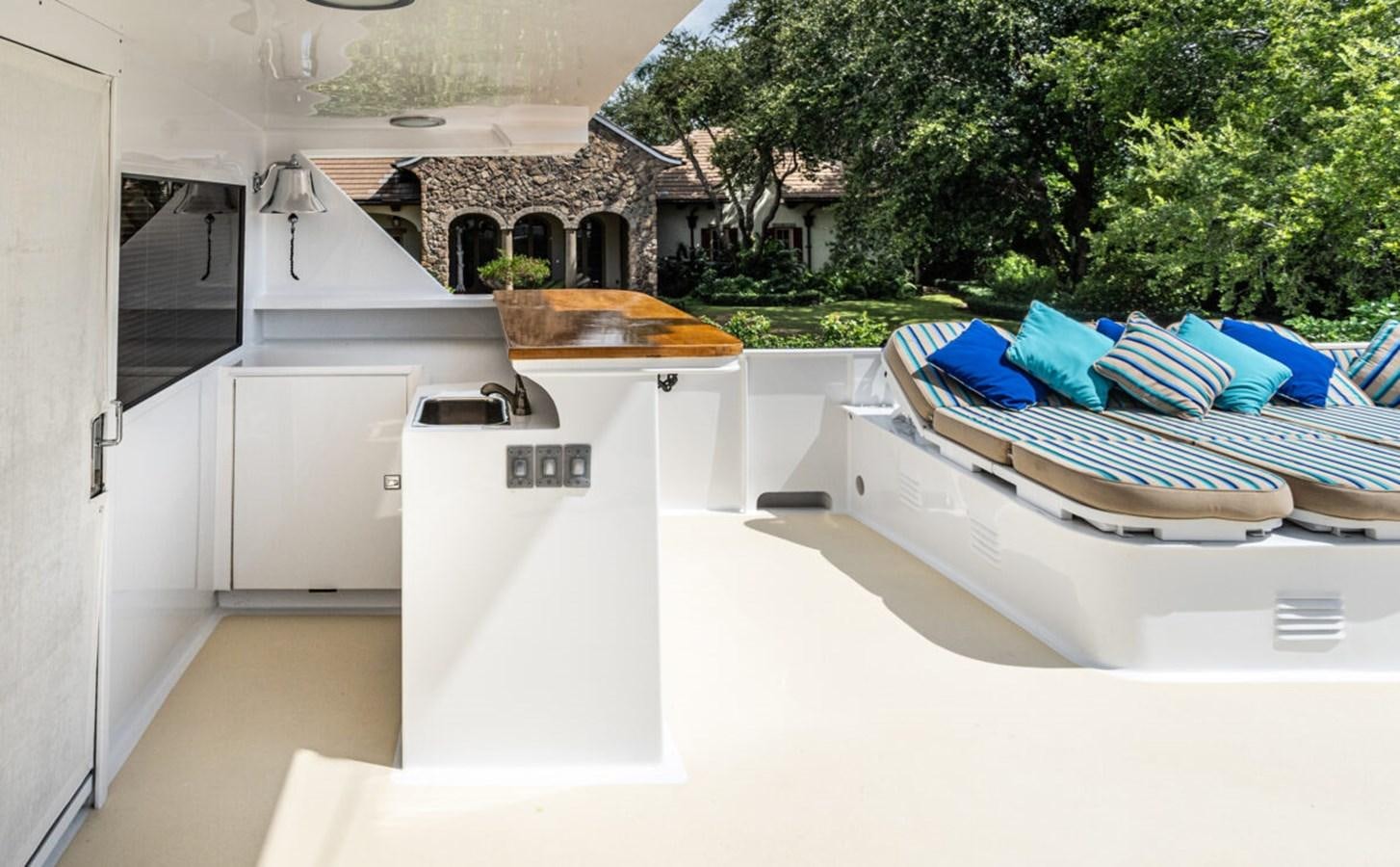a white boat in a pool aboard LE MONTRACHET Yacht for Sale