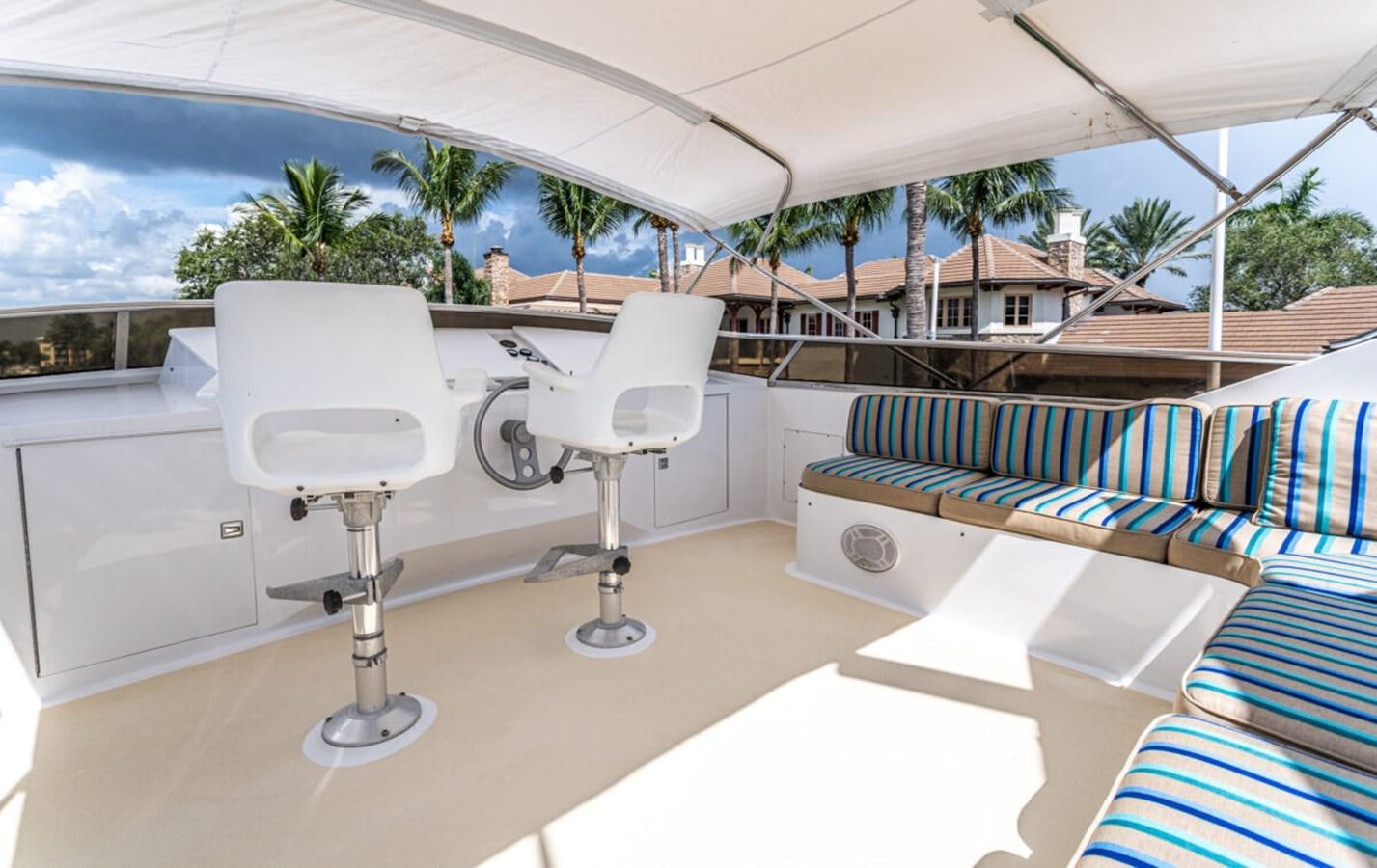 a white chair on a balcony aboard LE MONTRACHET Yacht for Sale