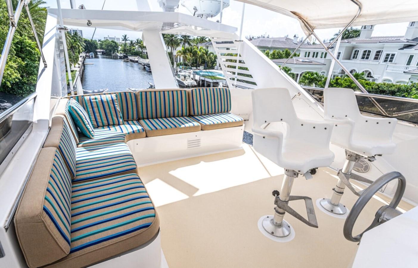 a white chair on a boat aboard LE MONTRACHET Yacht for Sale