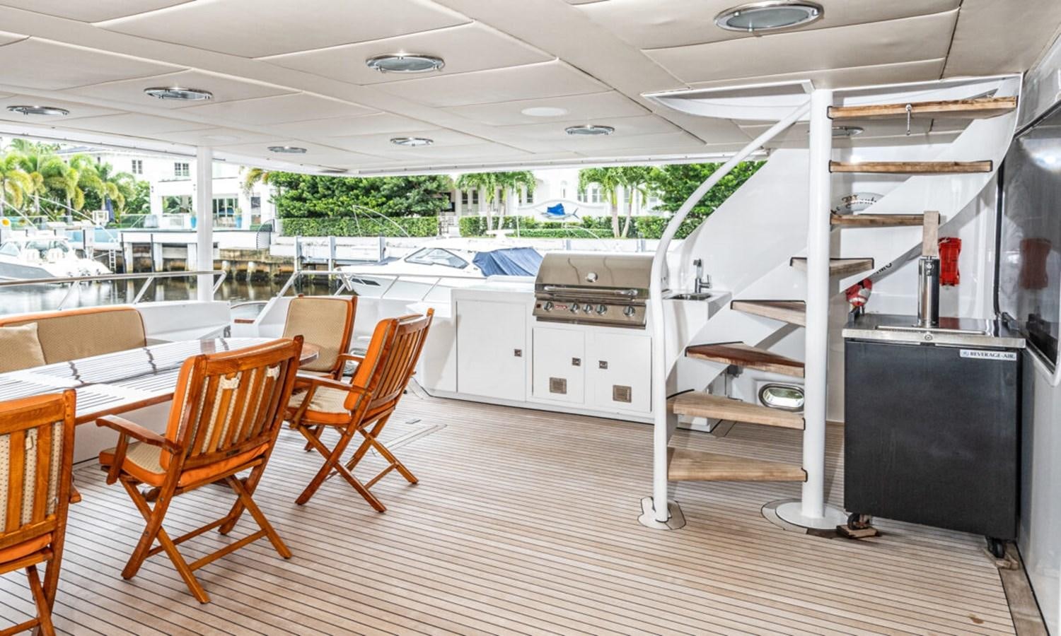 a room with a staircase and chairs aboard LE MONTRACHET Yacht for Sale