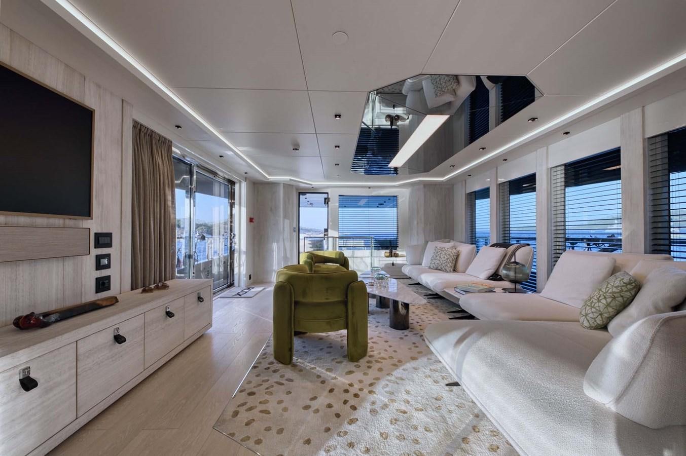 a living room with a couch and a tv aboard ROCK X Yacht for Sale
