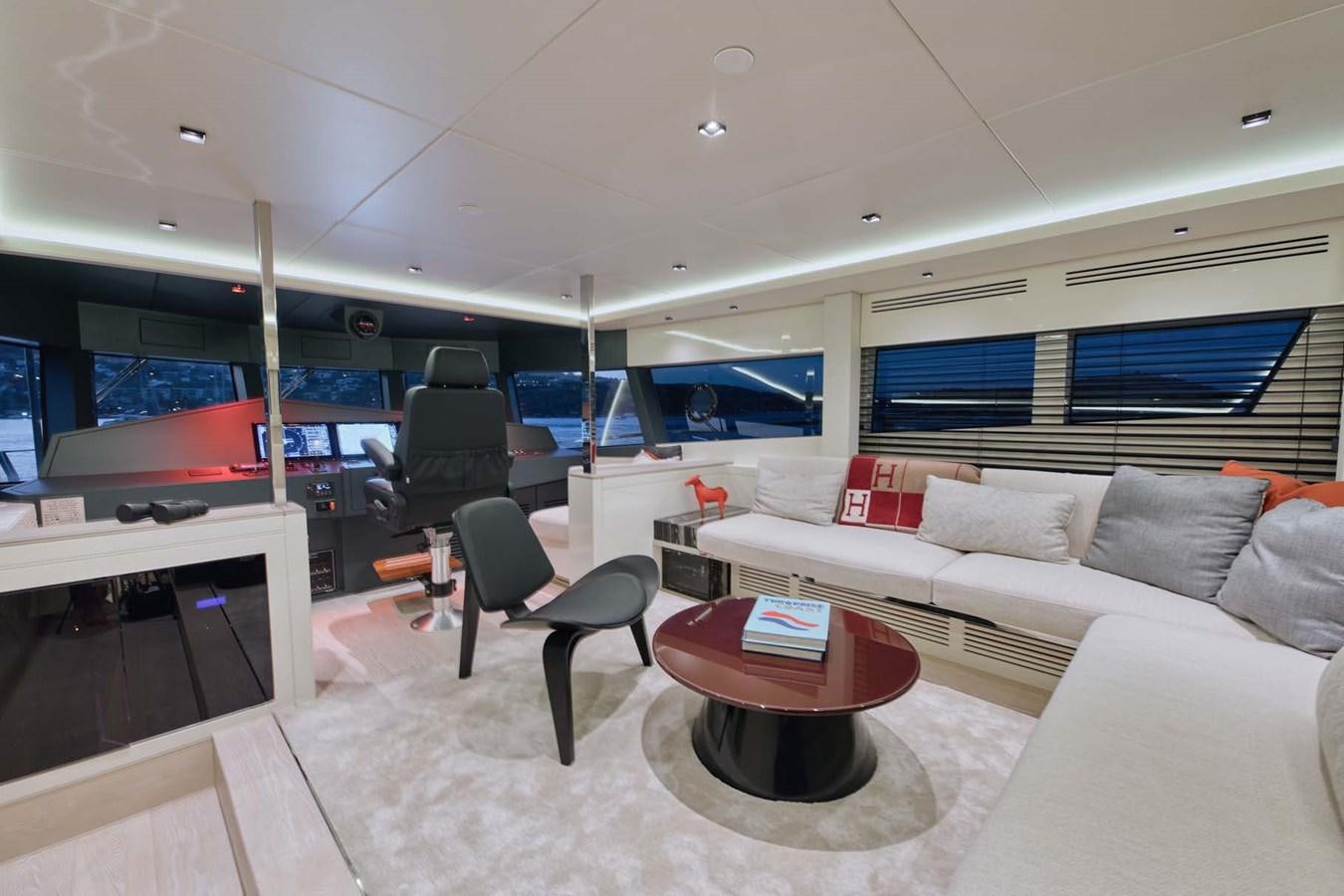 a living room with a couch and a table aboard ROCK X Yacht for Sale