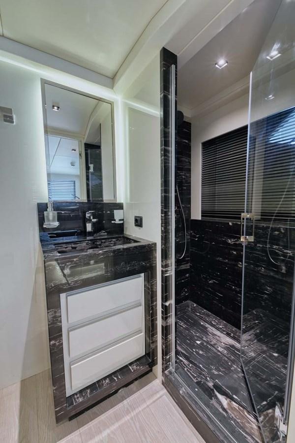 a kitchen with a glass door aboard ROCK X Yacht for Sale
