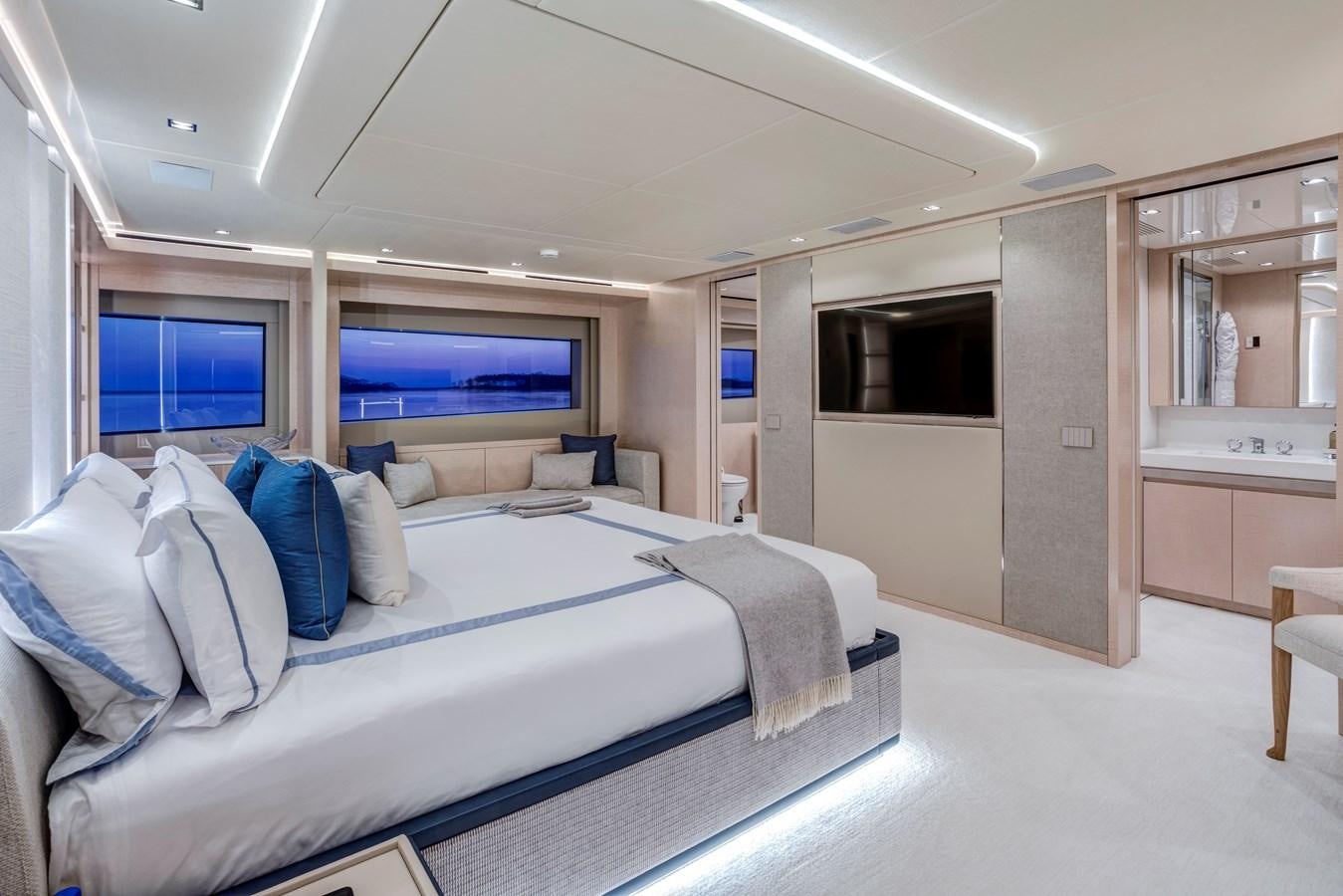 a large bedroom with a bed aboard MYSTERE Yacht for Sale