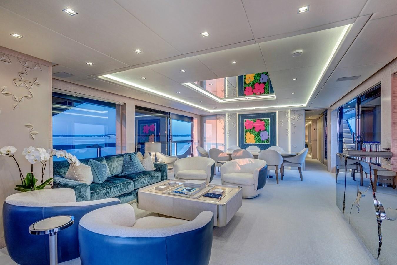 a living room with a large window aboard MYSTERE Yacht for Sale