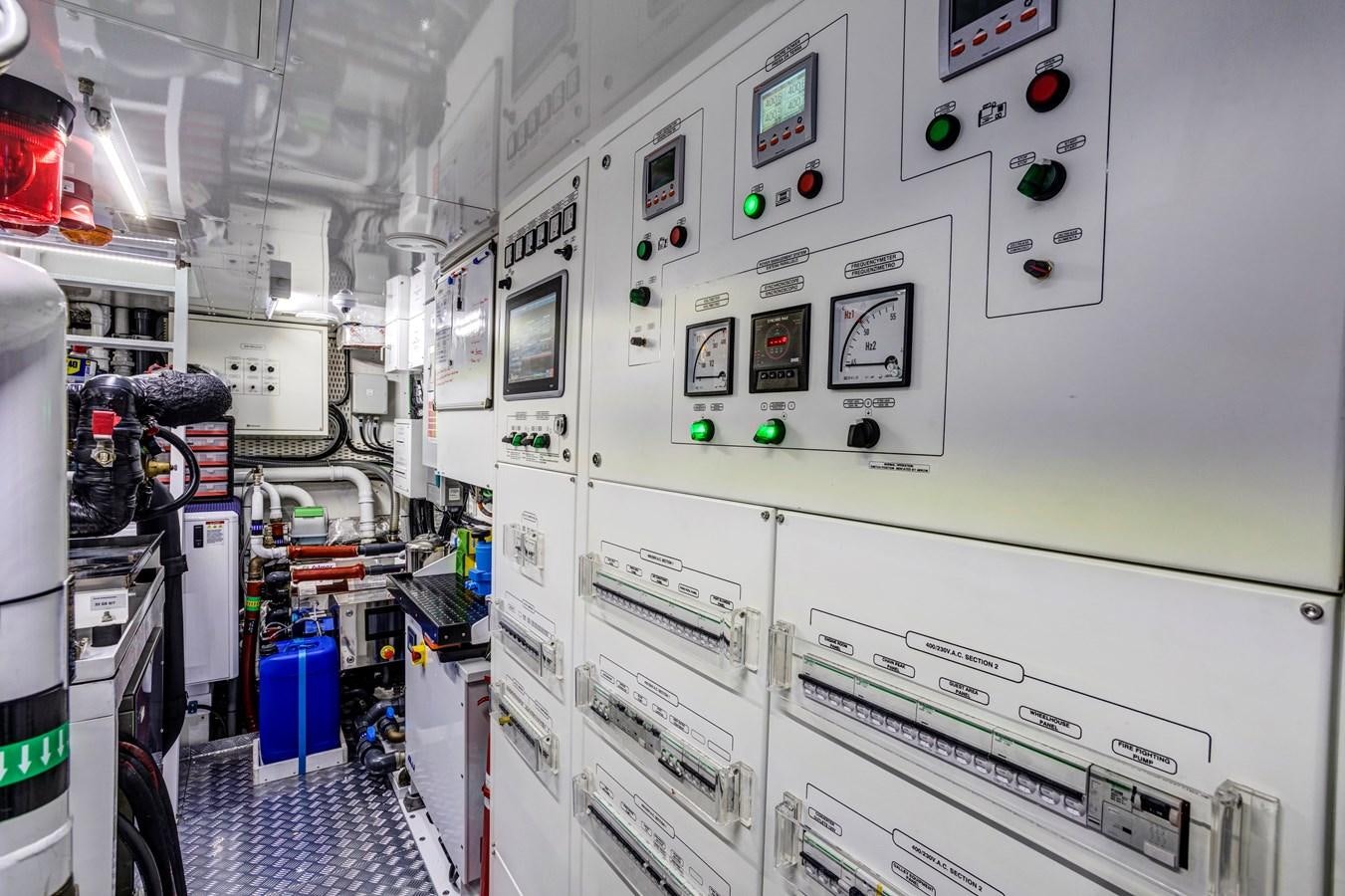 a room with many computer screens aboard MYSTERE Yacht for Sale