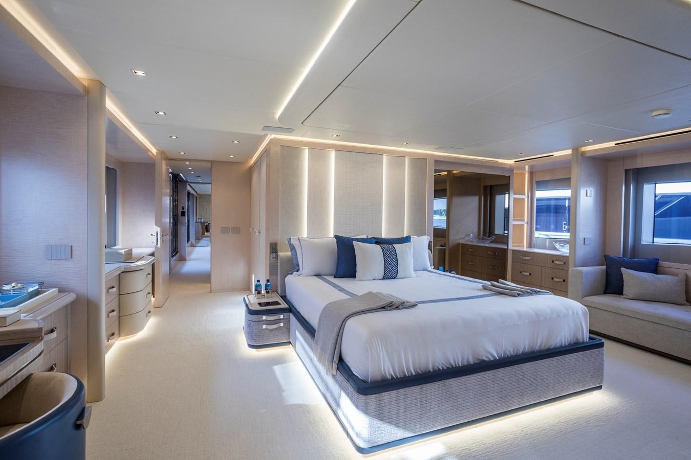 a room with a bed and a couch aboard MYSTERE Yacht for Sale