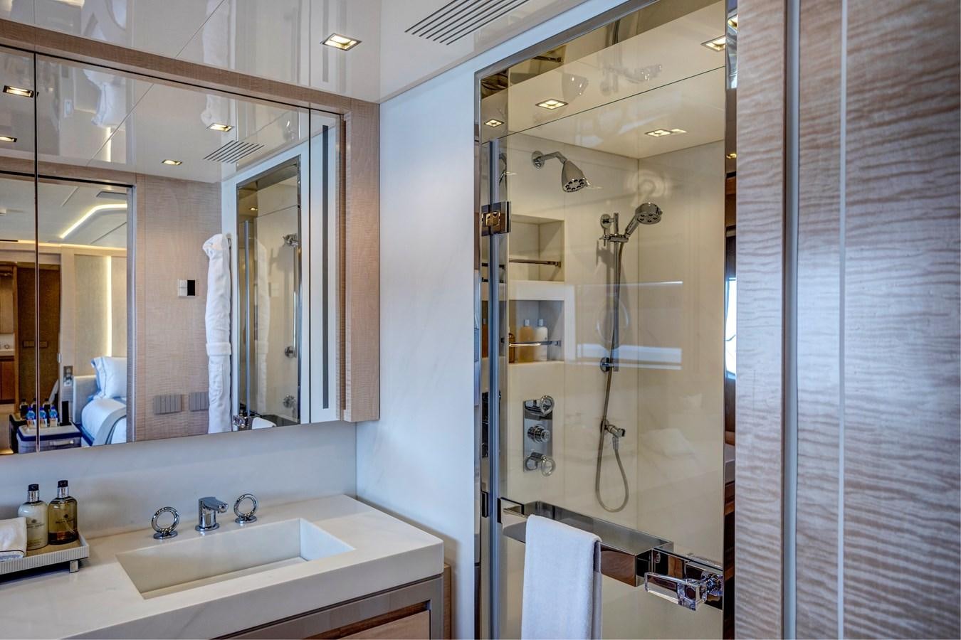 a bathroom with a large mirror aboard MYSTERE Yacht for Sale