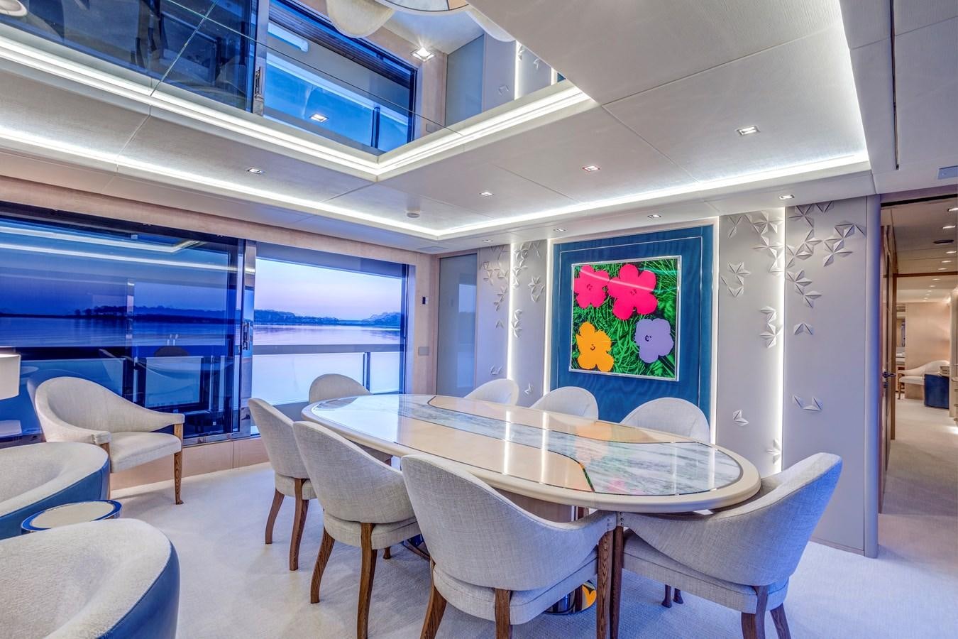 a dining table in a room aboard MYSTERE Yacht for Sale