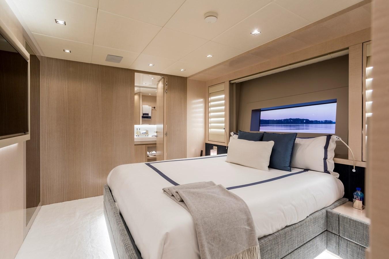 a bed in a room aboard MYSTERE Yacht for Sale