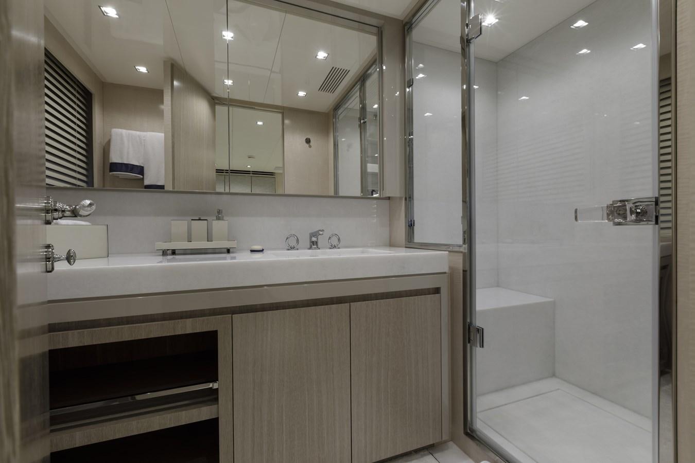 a bathroom with a large mirror aboard MYSTERE Yacht for Sale