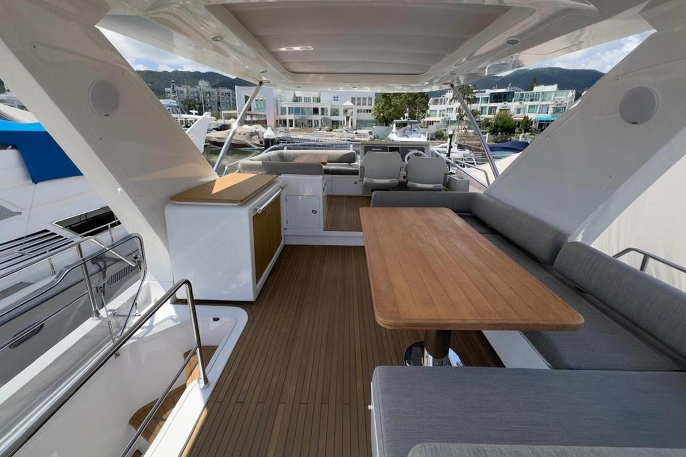 inside of a building with a table and chairs aboard AZIMUT 66 FLY Yacht for Sale