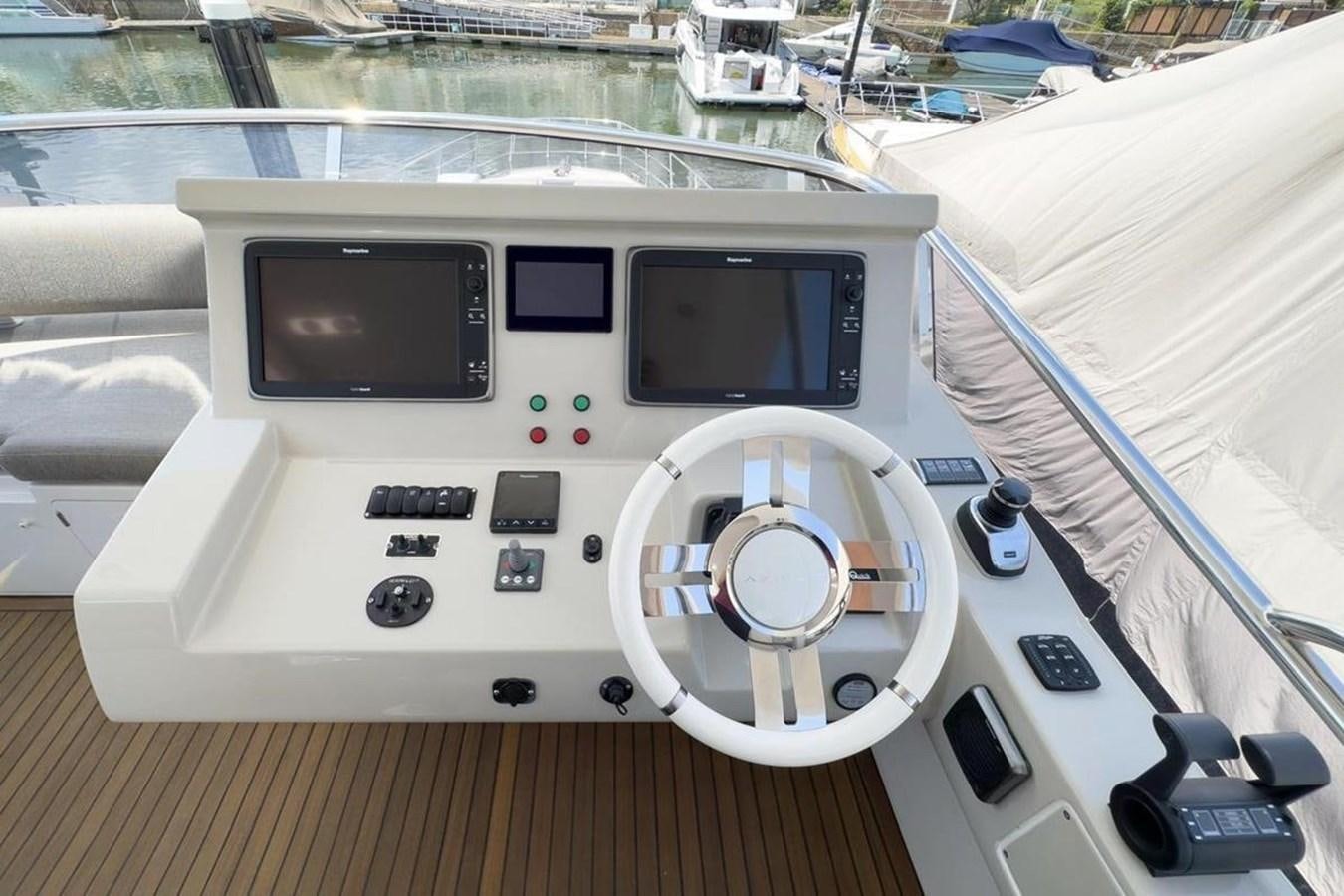 a white boat with a screen aboard AZIMUT 66 FLY Yacht for Sale