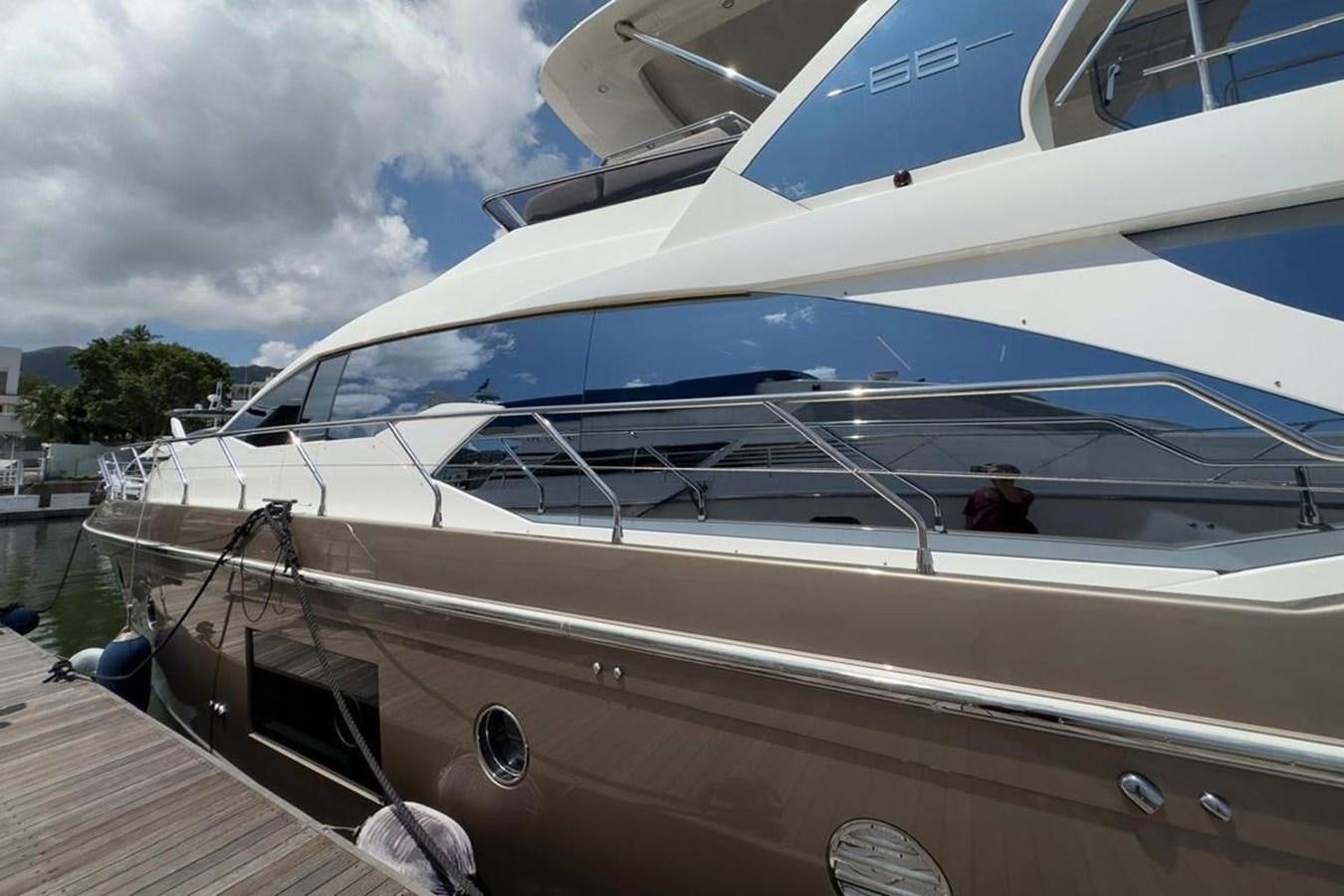 a boat docked at a pier aboard AZIMUT 66 FLY Yacht for Sale