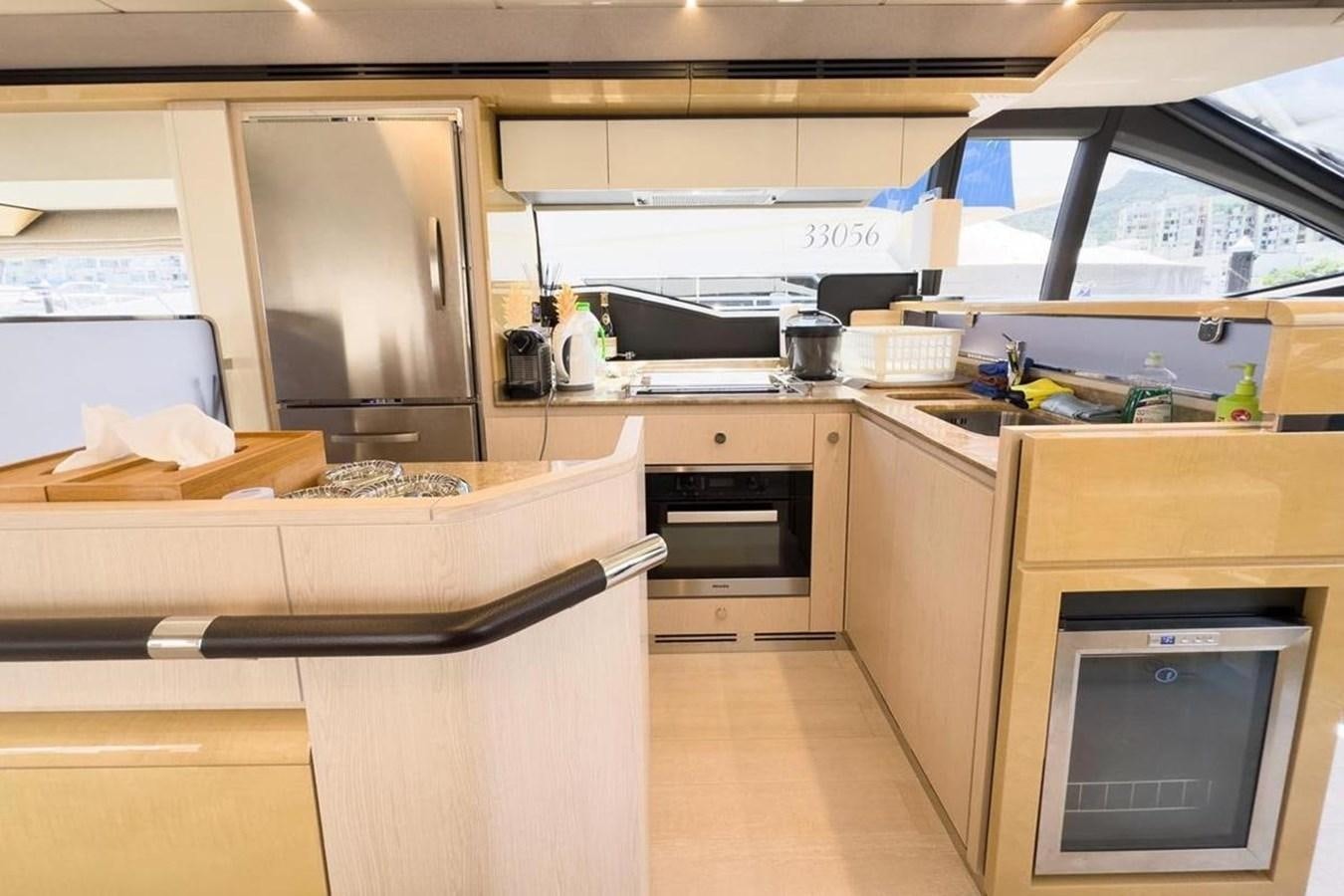 a kitchen with a microwave oven and a microwave aboard AZIMUT 66 FLY Yacht for Sale