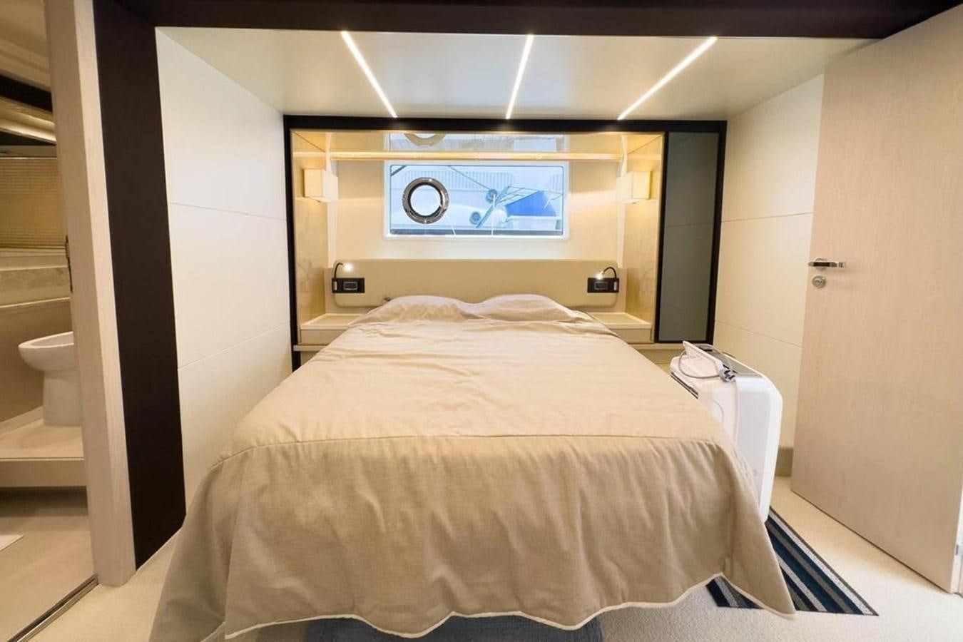 a bed in a room aboard AZIMUT 66 FLY Yacht for Sale