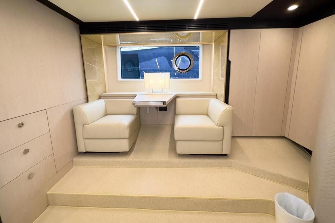 a room with a couch and a television aboard AZIMUT 66 FLY Yacht for Sale