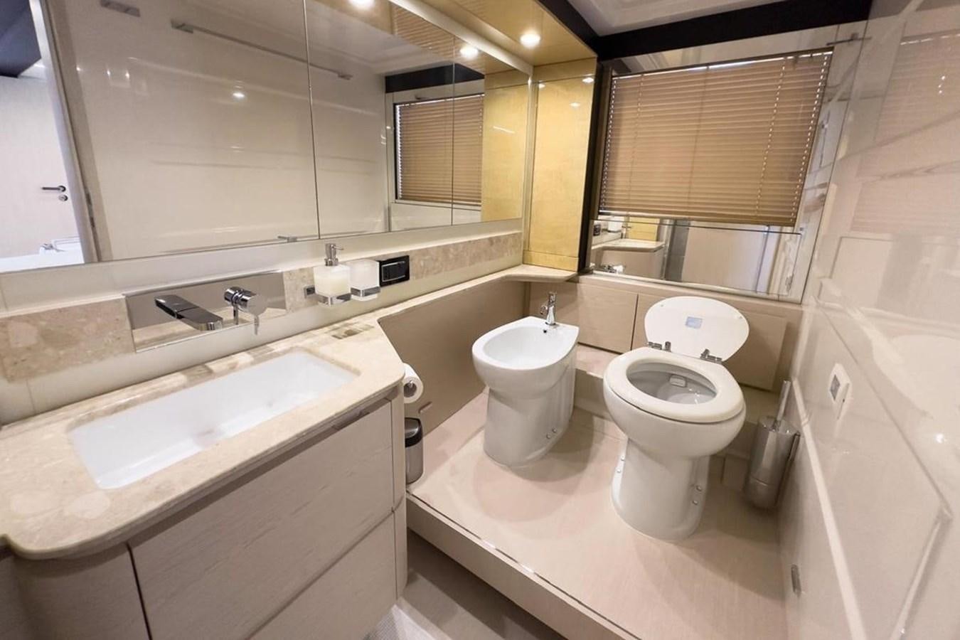 a bathroom with a large mirror aboard AZIMUT 66 FLY Yacht for Sale