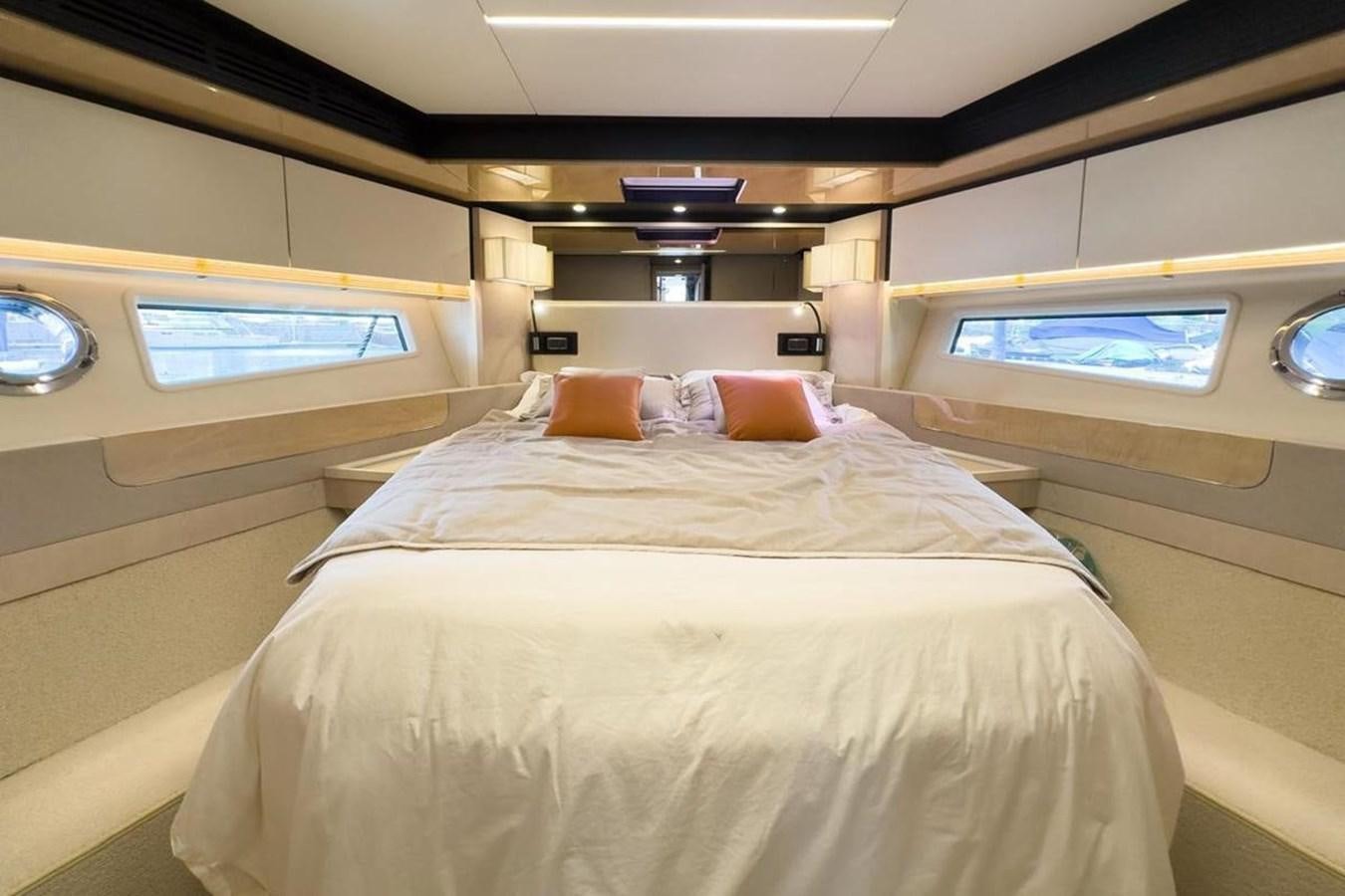 a bed with a white sheet and pillows aboard AZIMUT 66 FLY Yacht for Sale
