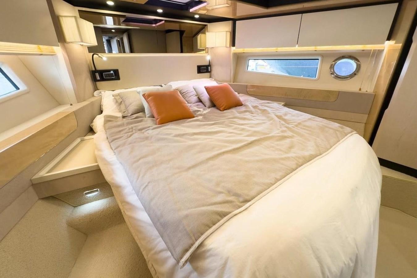 a bed with pillows aboard AZIMUT 66 FLY Yacht for Sale