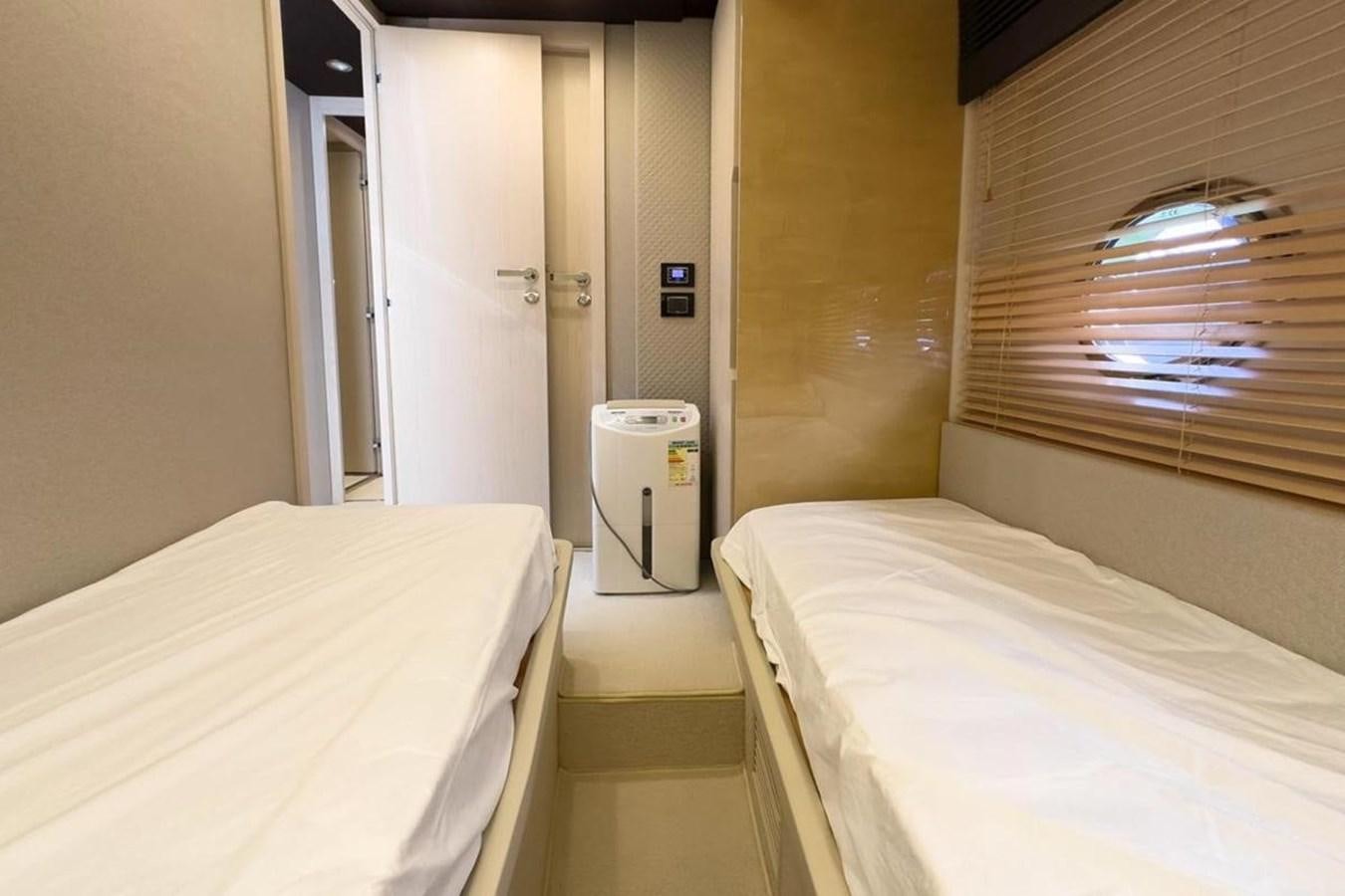 a room with two beds aboard AZIMUT 66 FLY Yacht for Sale