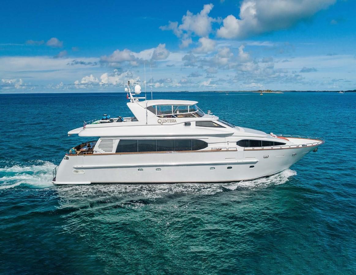 a white yacht in the water aboard QUINTESSA Yacht for Sale