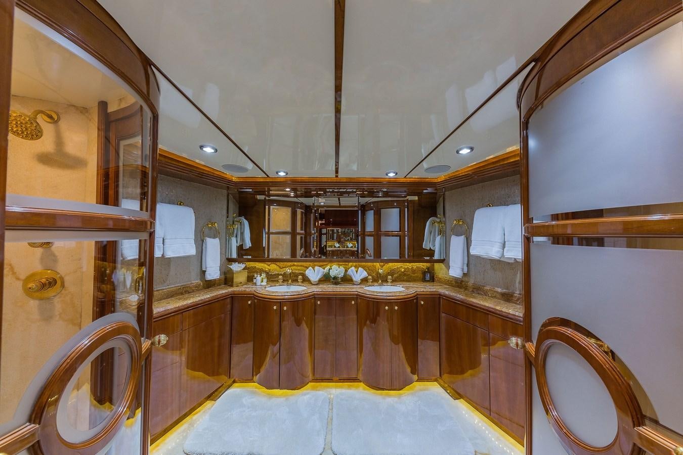 a large bathroom with a large mirror aboard QUINTESSA Yacht for Sale