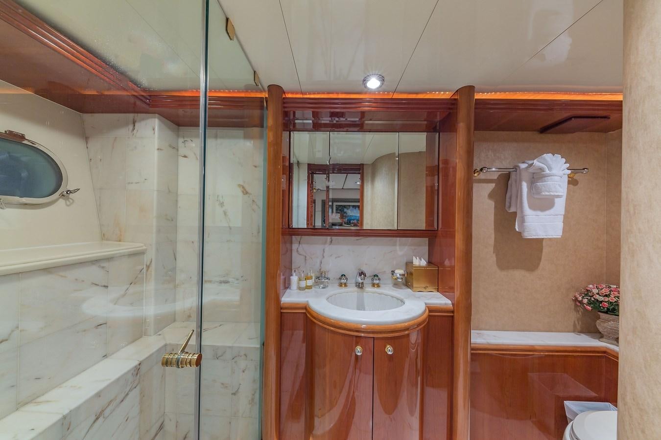 a bathroom with a shower and sink aboard QUINTESSA Yacht for Sale