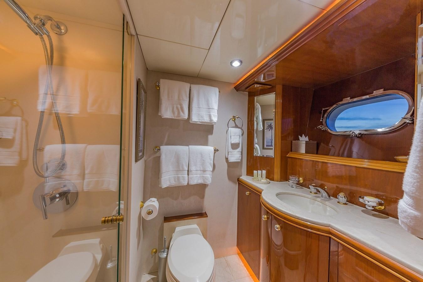 a bathroom with a large mirror aboard QUINTESSA Yacht for Sale