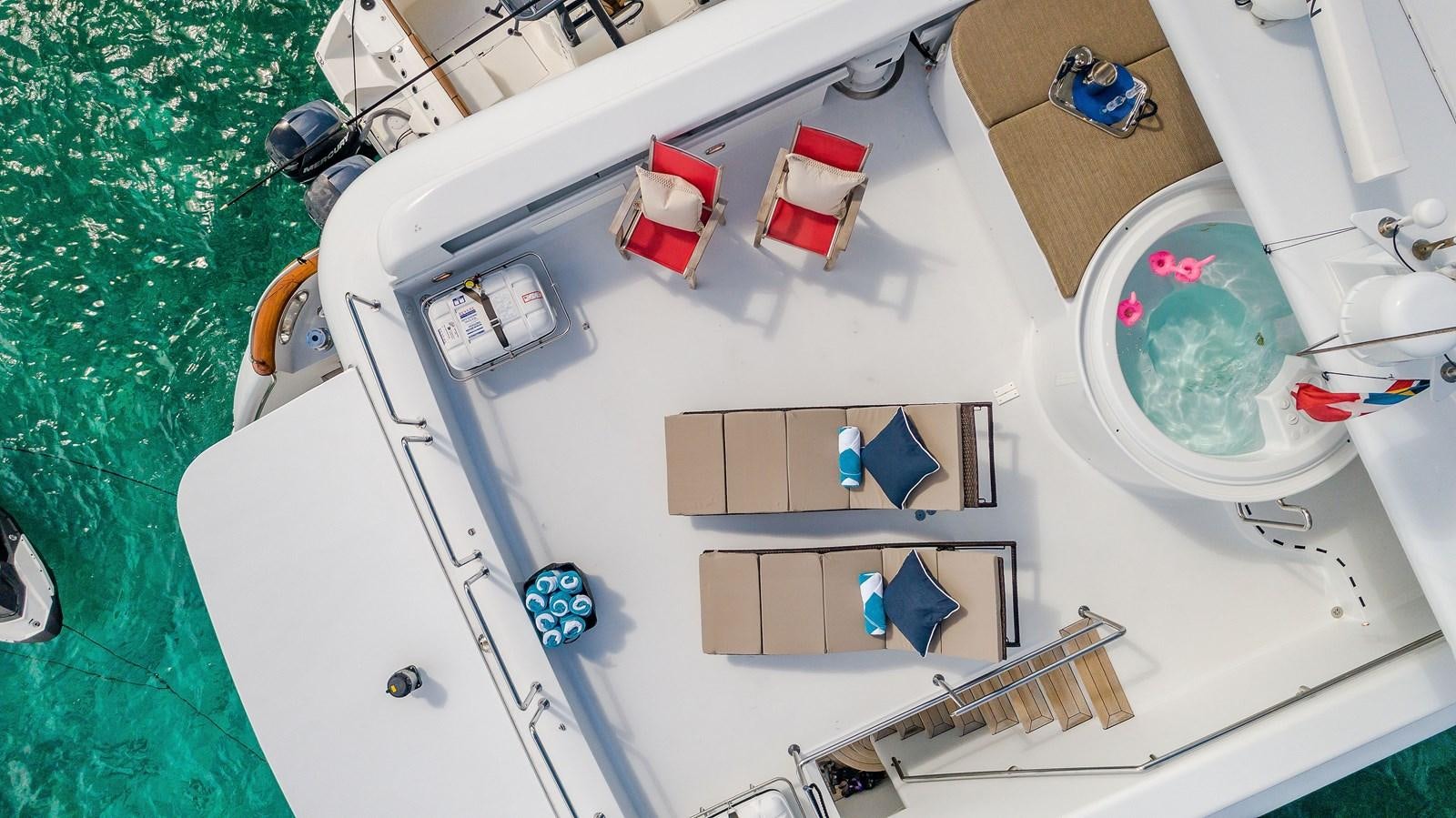 a white sink with a faucet and a mirror aboard QUINTESSA Yacht for Sale