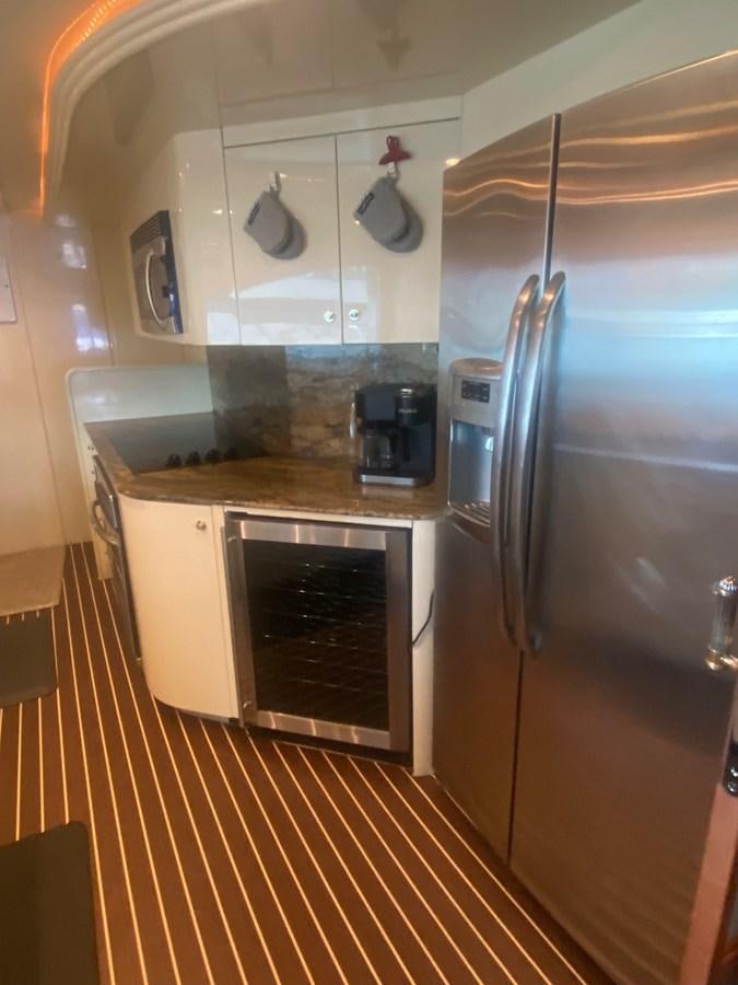 a kitchen with stainless steel appliances aboard QUINTESSA Yacht for Sale
