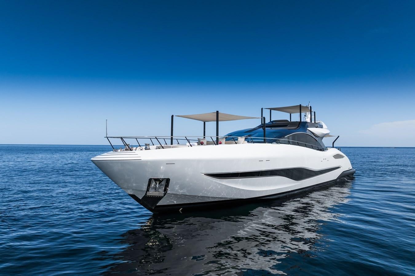 a white yacht on the water aboard JACQPOT Yacht for Sale
