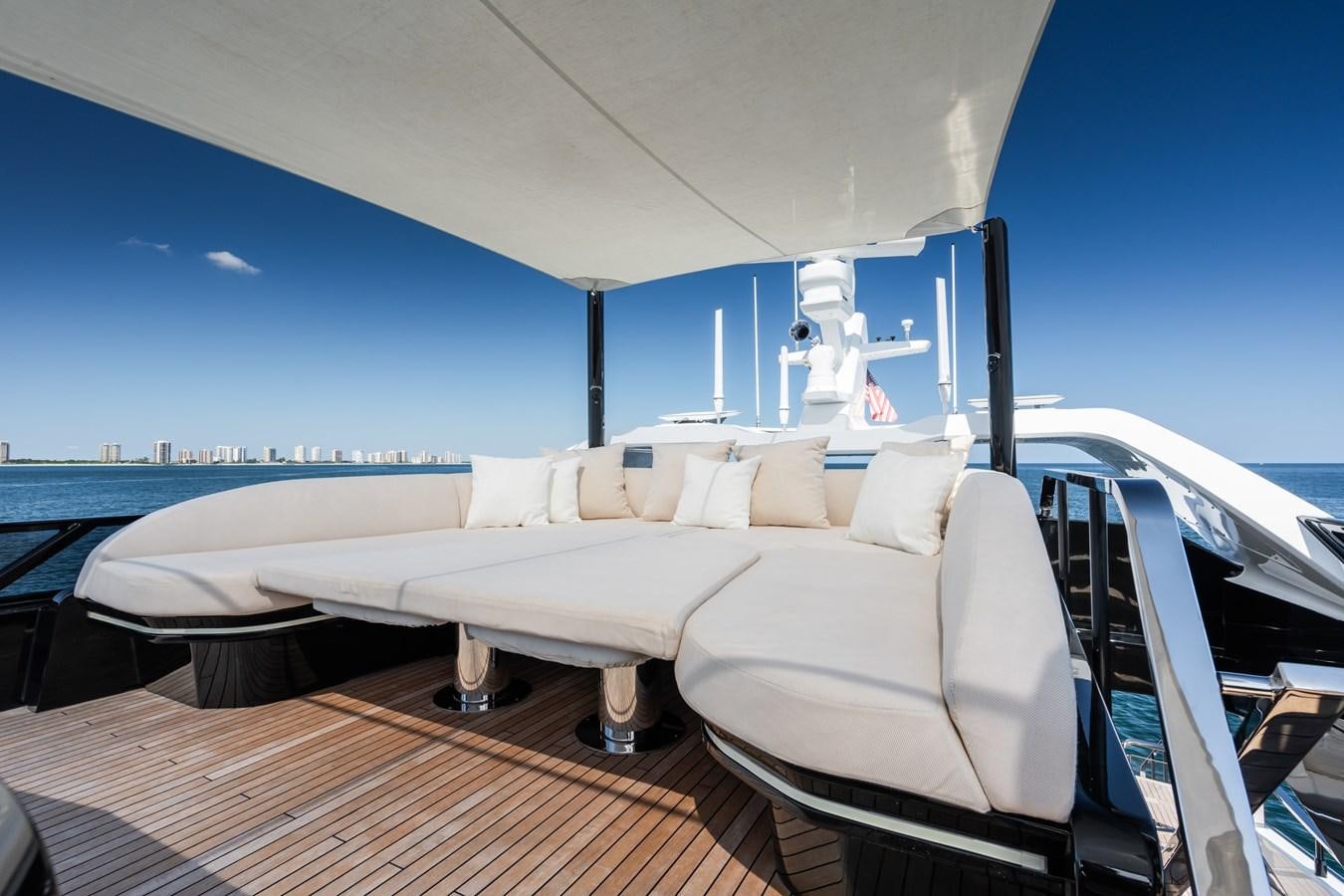 a white bed on a boat aboard JACQPOT Yacht for Sale