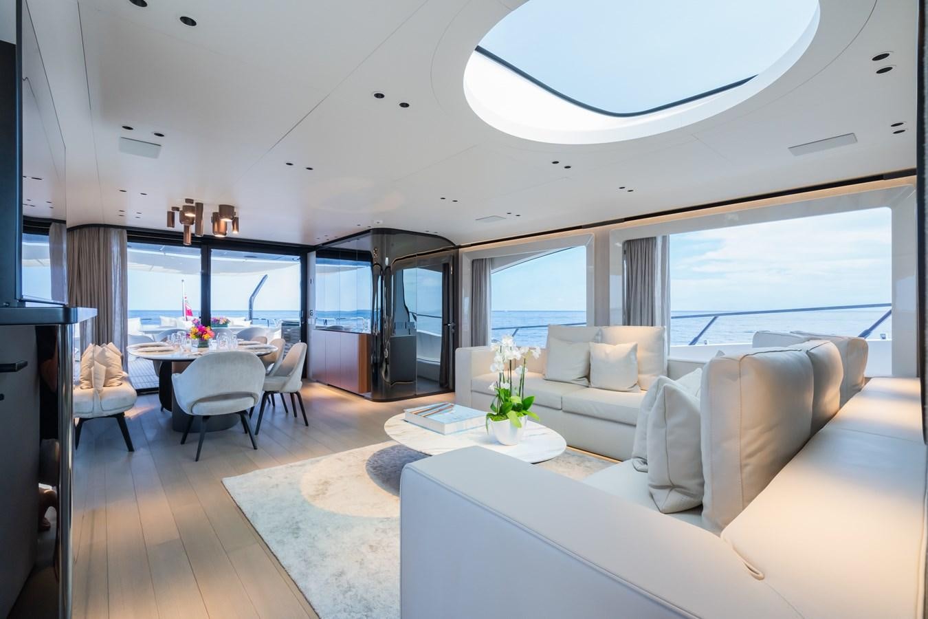 a living room with a large window aboard JACQPOT Yacht for Sale