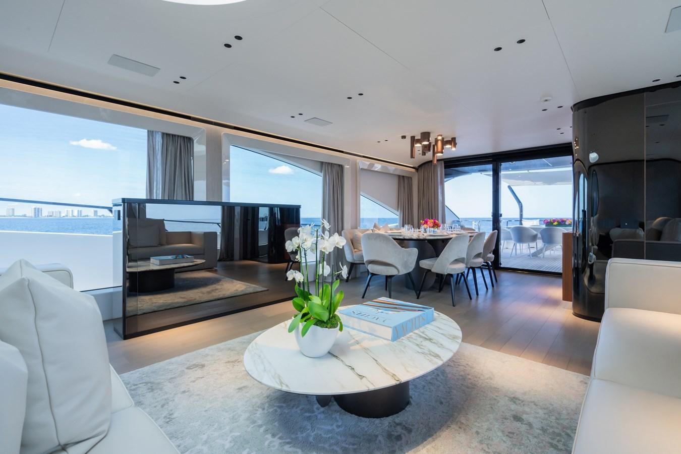 a living room with a large window aboard JACQPOT Yacht for Sale