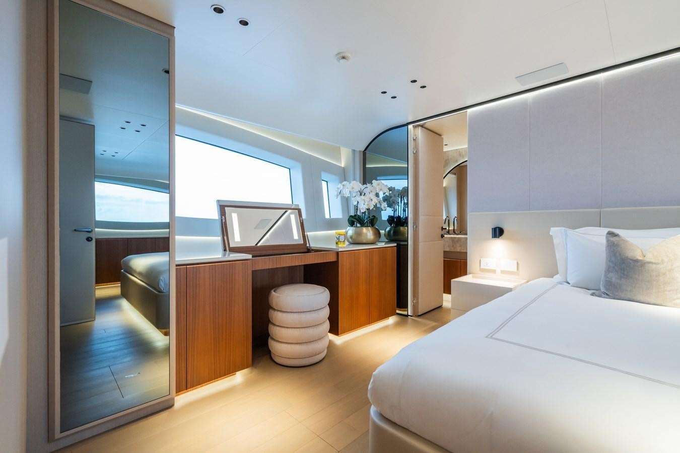 a bedroom with a bed and a sink aboard JACQPOT Yacht for Sale