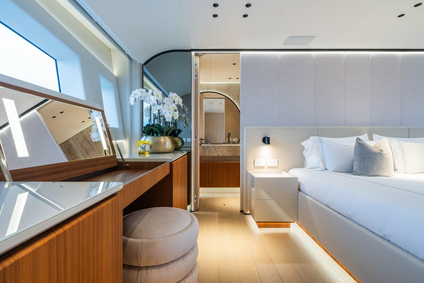 a room with a bed and a mirror aboard JACQPOT Yacht for Sale