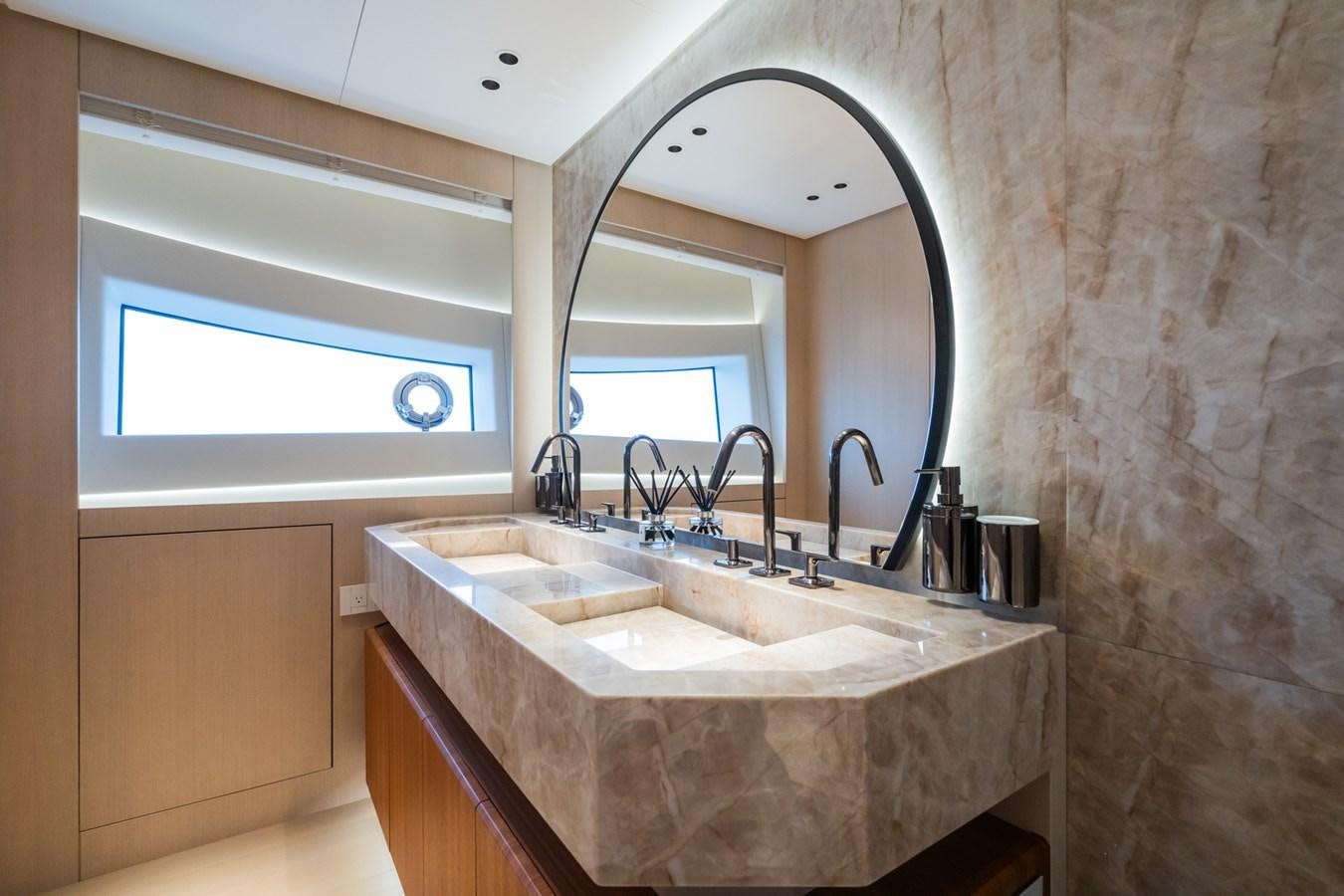 a bathroom with a large mirror aboard JACQPOT Yacht for Sale