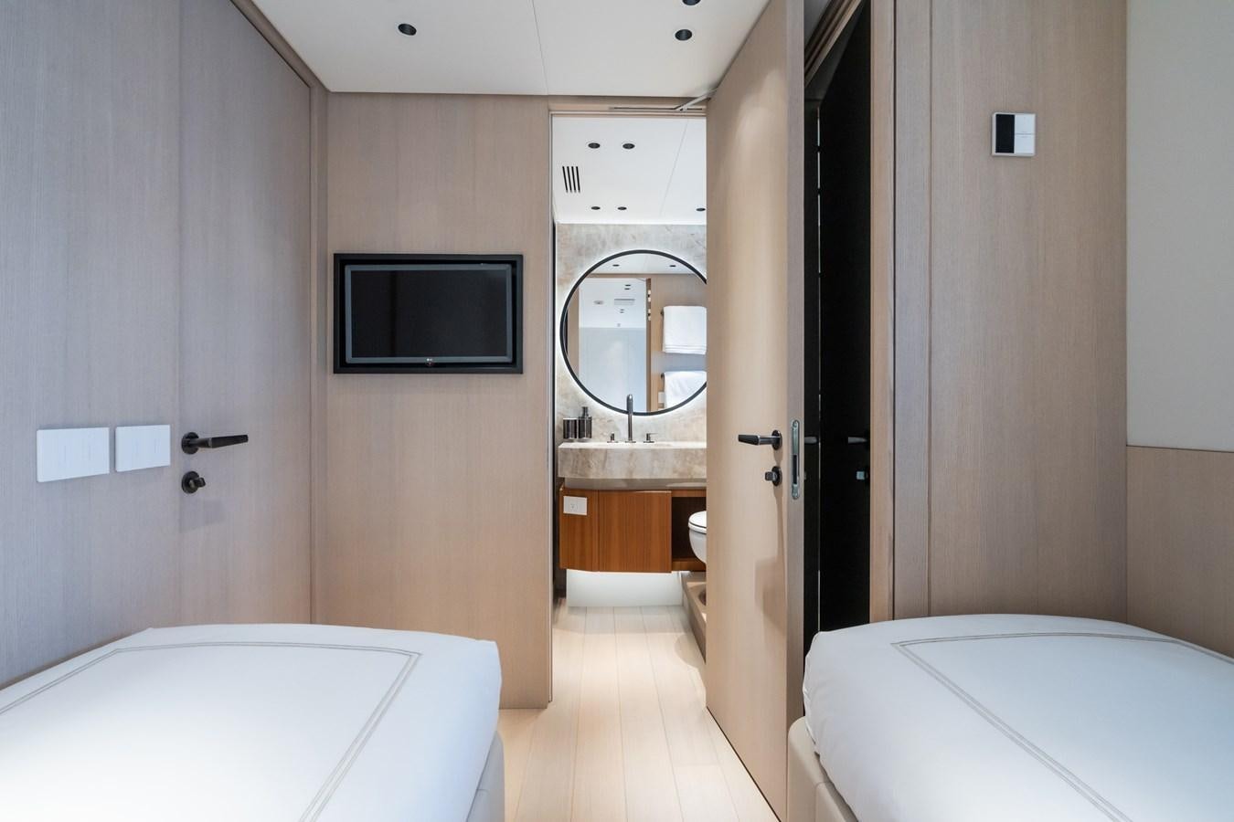 a bathroom with a large mirror aboard JACQPOT Yacht for Sale