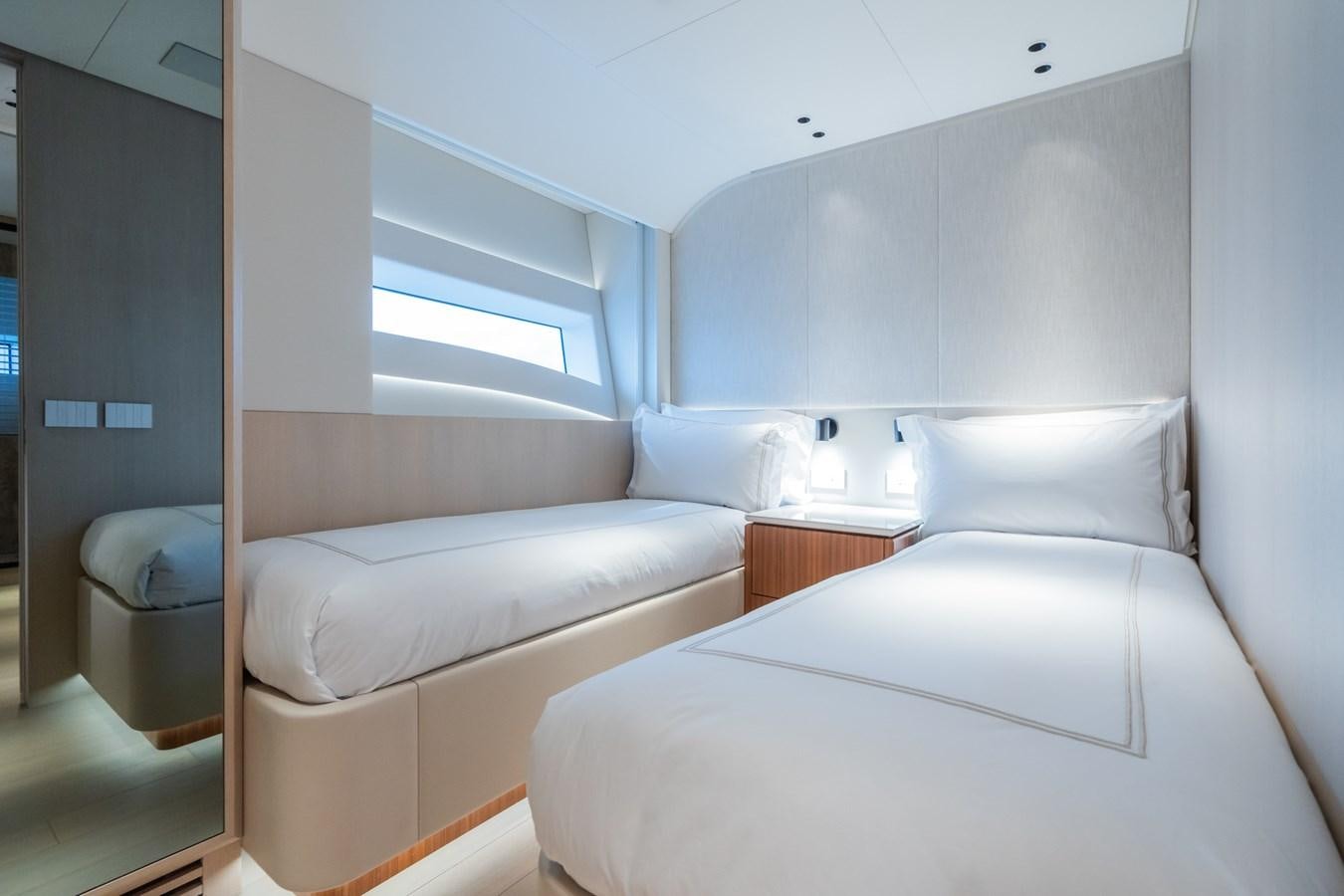 a room with two beds aboard JACQPOT Yacht for Sale