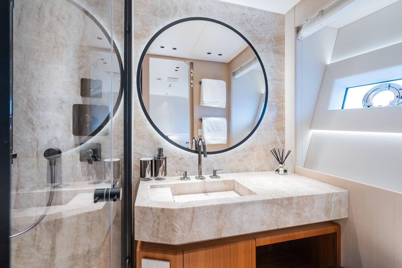a bathroom with a large mirror aboard JACQPOT Yacht for Sale