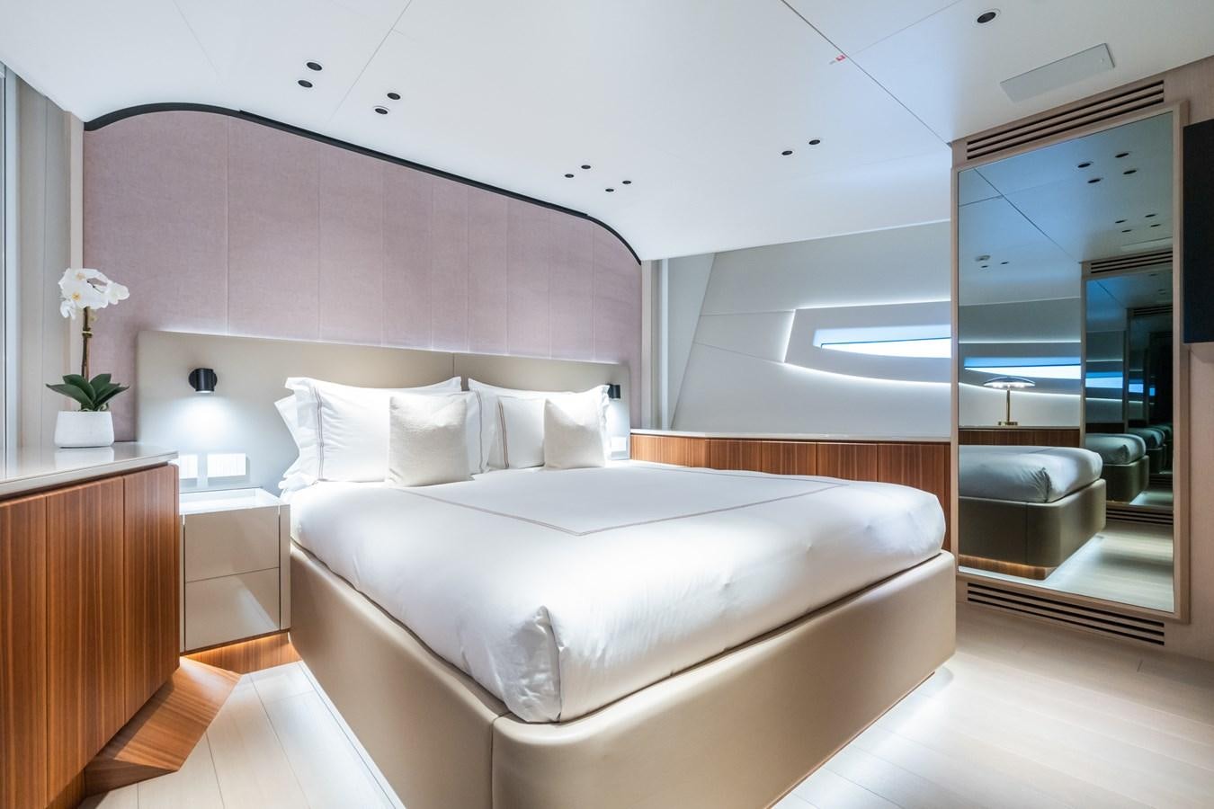 a large white bed in a room aboard JACQPOT Yacht for Sale