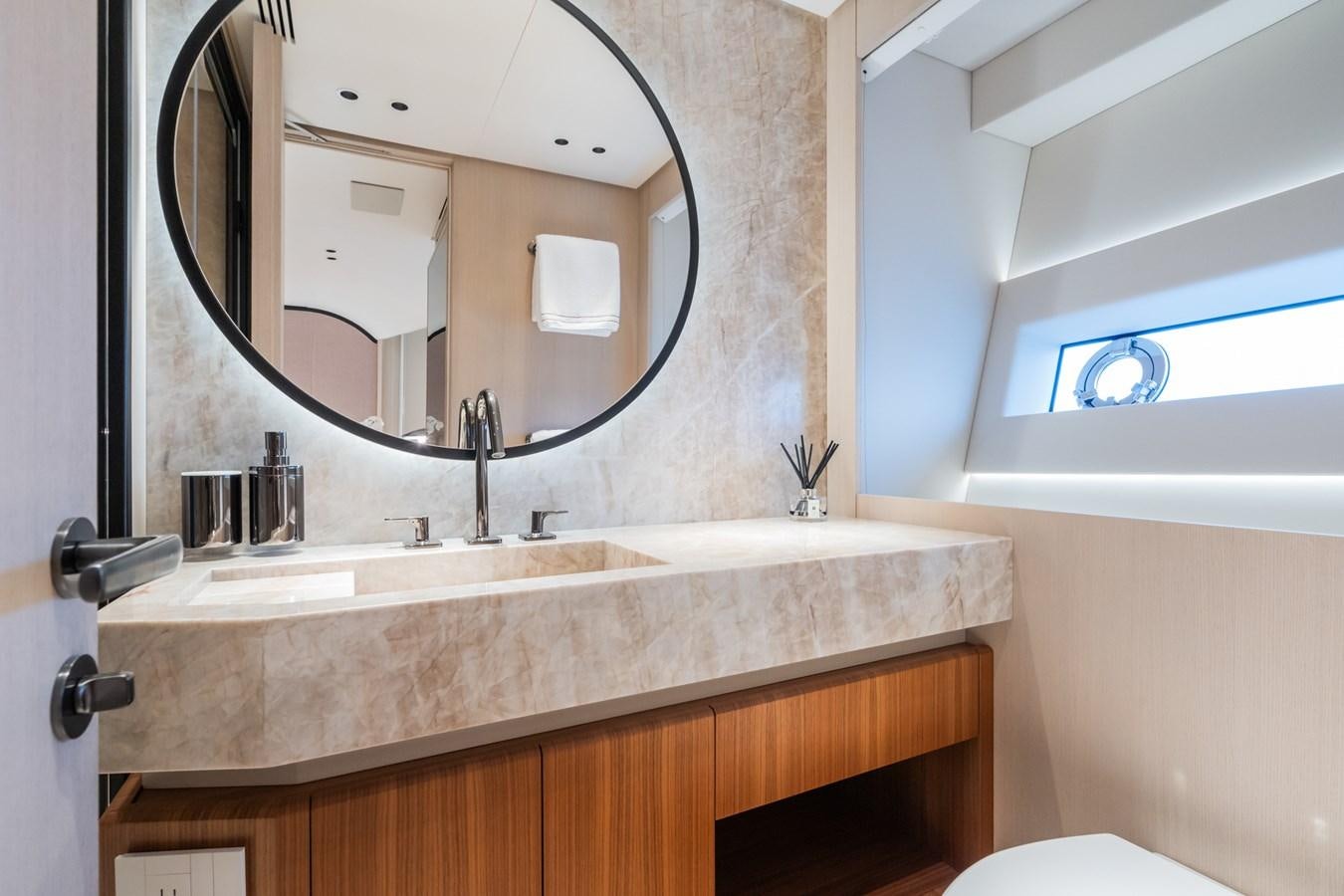 a bathroom with a large mirror aboard JACQPOT Yacht for Sale