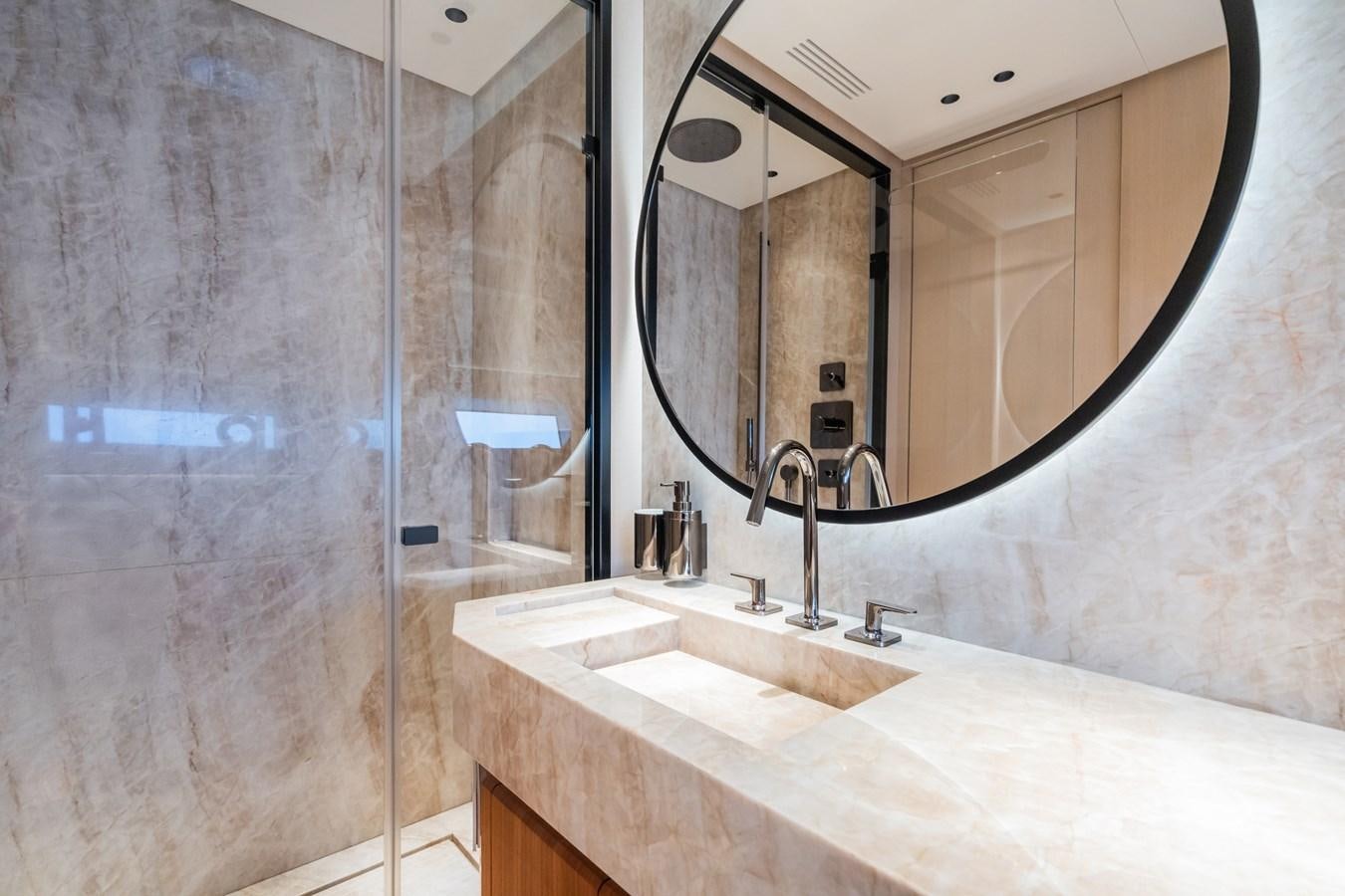 a bathroom with a large mirror aboard JACQPOT Yacht for Sale