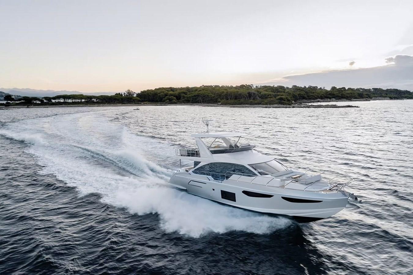 a white yacht on the water aboard 2023 AZIMUT FLY 78 Yacht for Sale