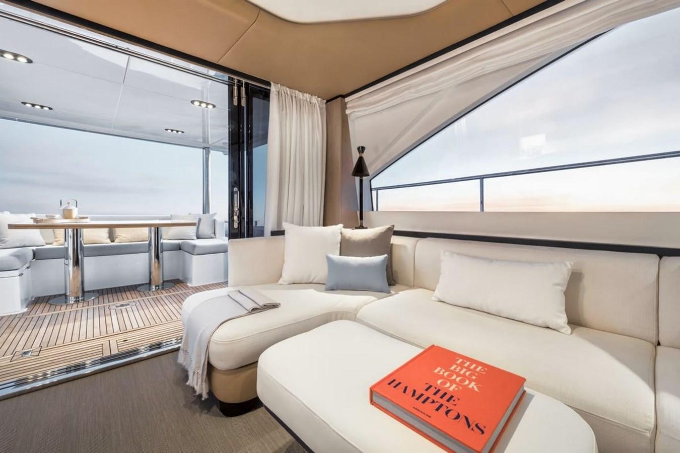 a room with a bed and a table aboard 2023 AZIMUT FLY 78 Yacht for Sale