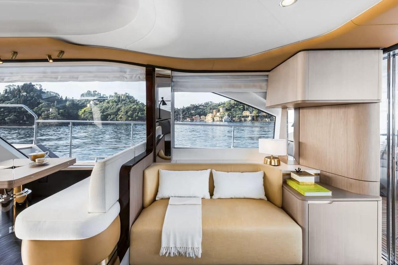 a room with a bed and a table and a window aboard 2023 AZIMUT FLY 78 Yacht for Sale