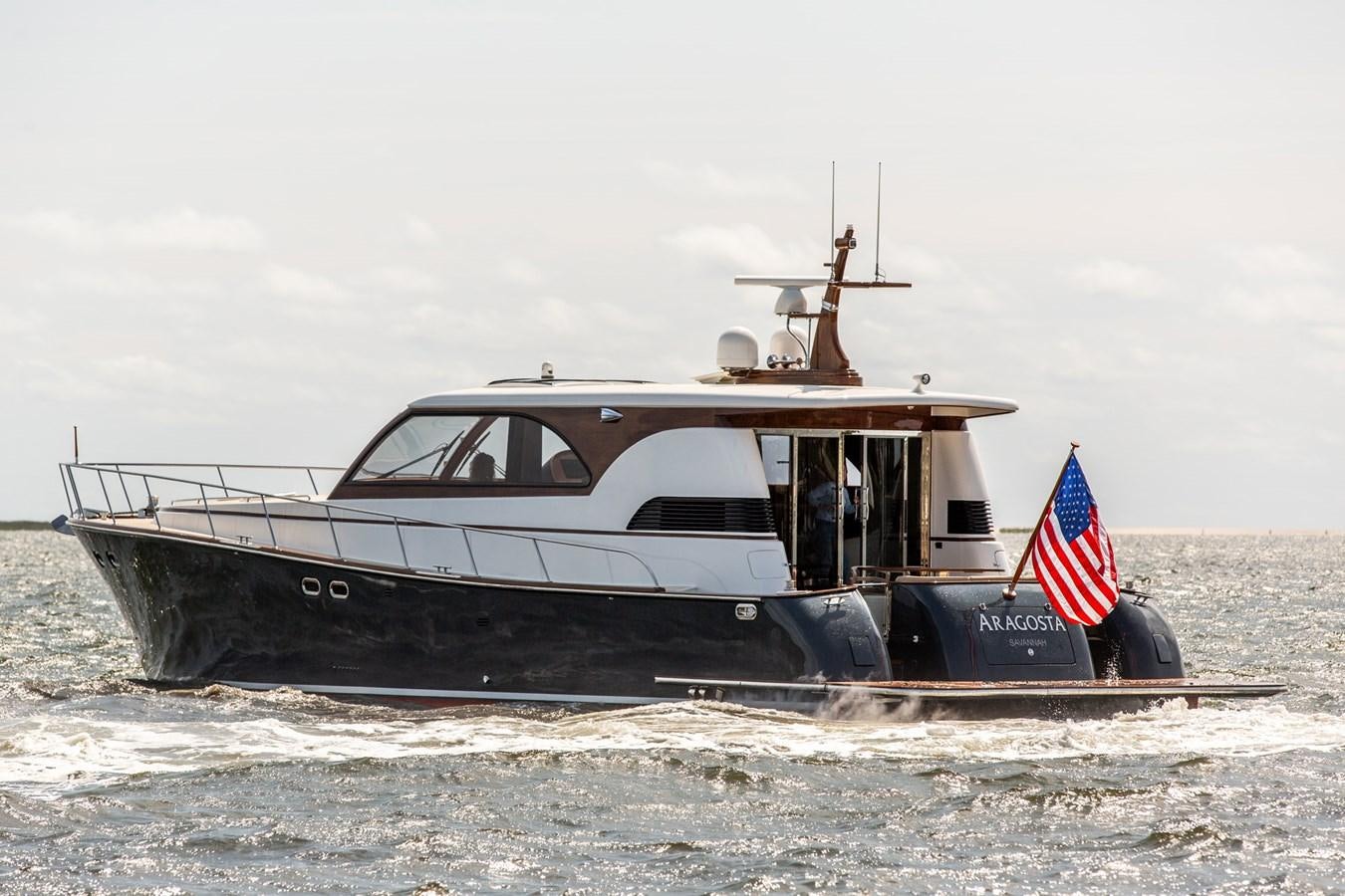 a boat on the beach aboard ARAGOSTA Yacht for Sale