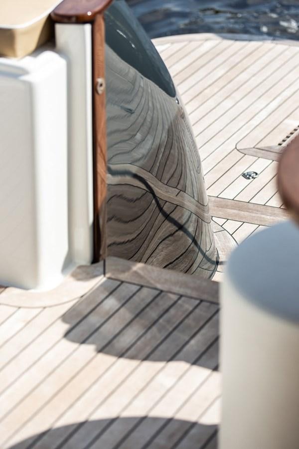 a black and brown shoe on a wooden surface aboard ARAGOSTA Yacht for Sale