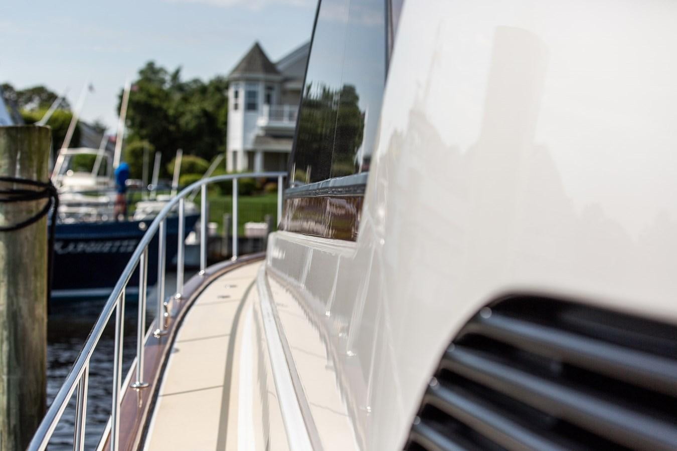 a white boat on a deck aboard ARAGOSTA Yacht for Sale